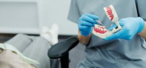 Dentist helps patients without teeth make dentures last