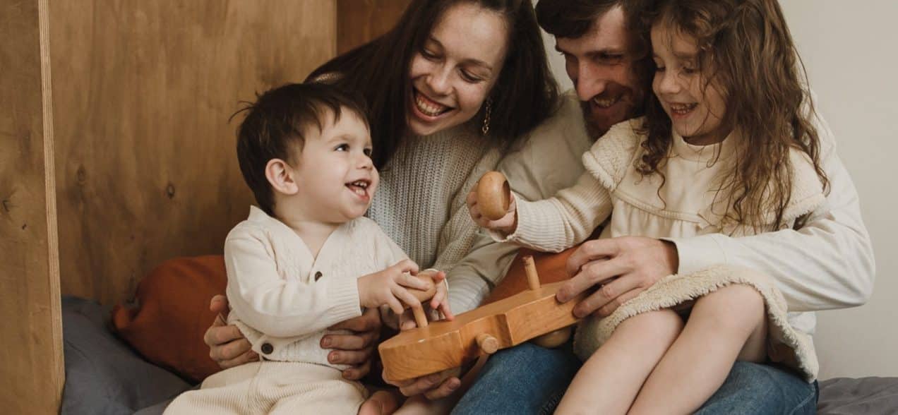 an image of a family smiling together at big smile dental